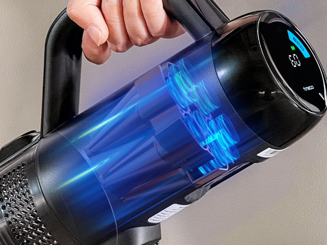 a hand holding a black headphone